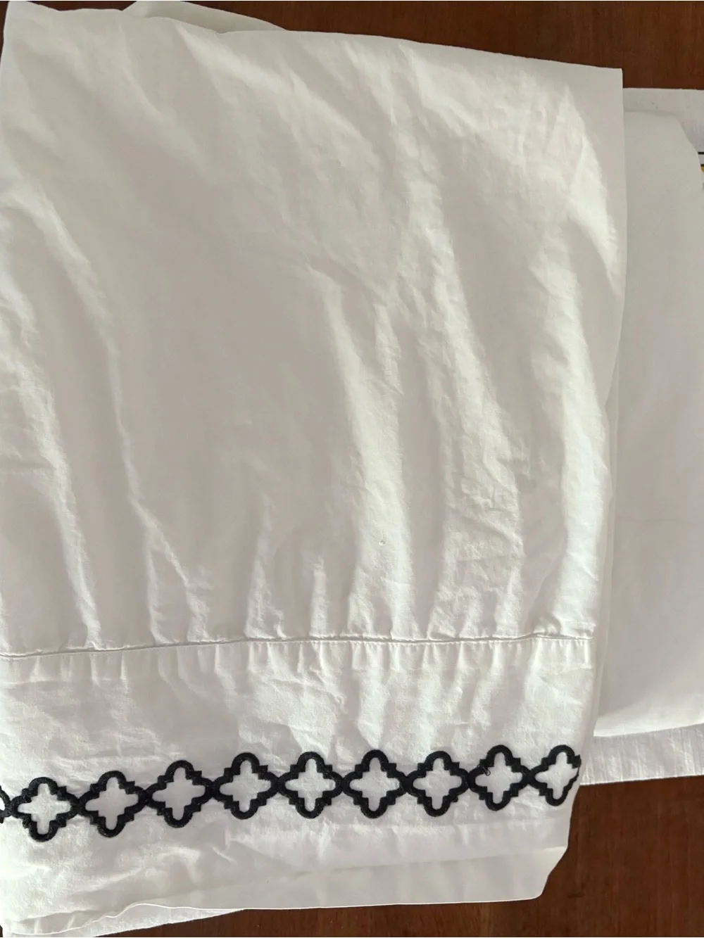 White Pillowcases with Black Embroidered Trellis Border